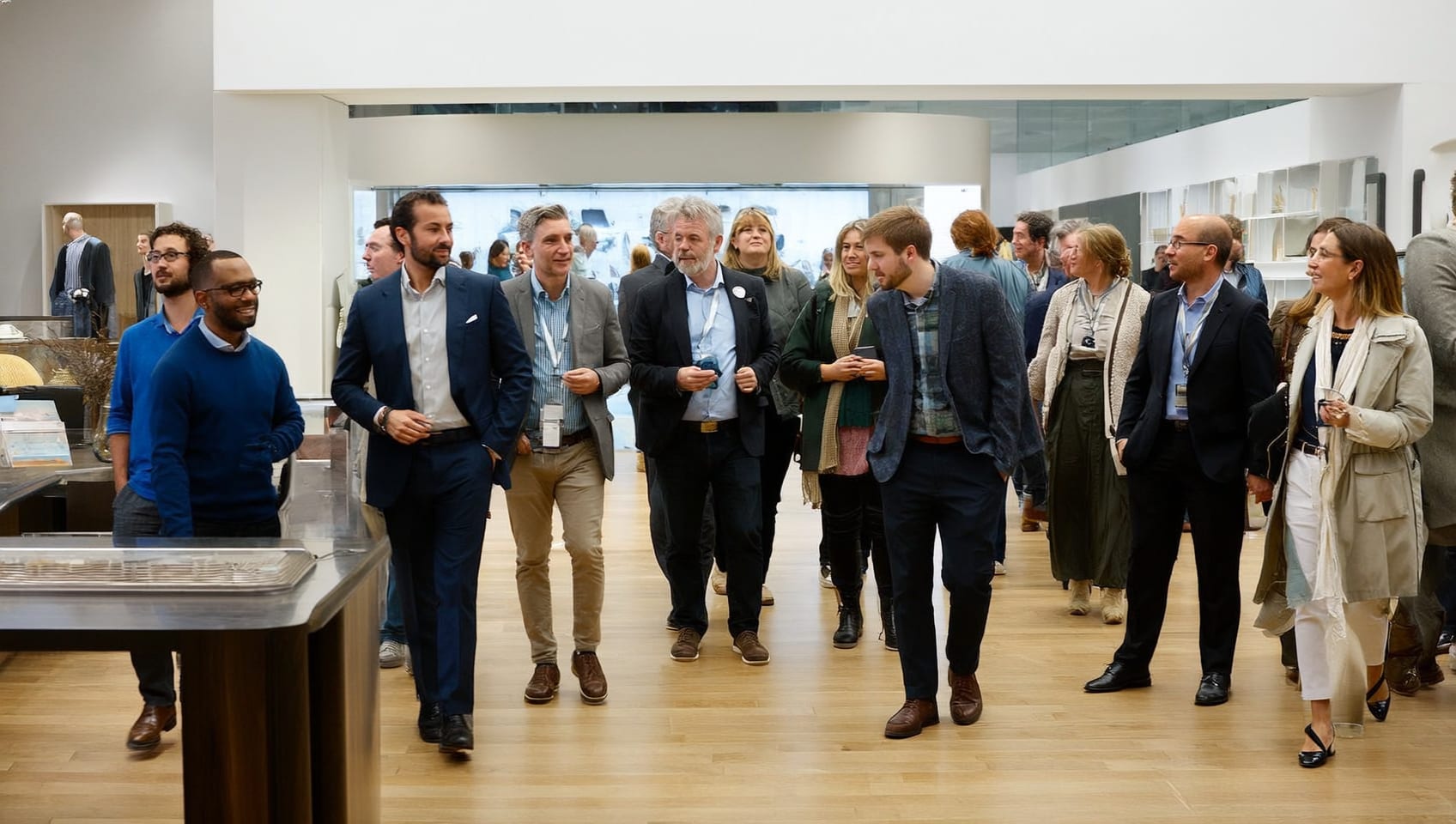 Prospective buyers touring a bright presale presentation centre