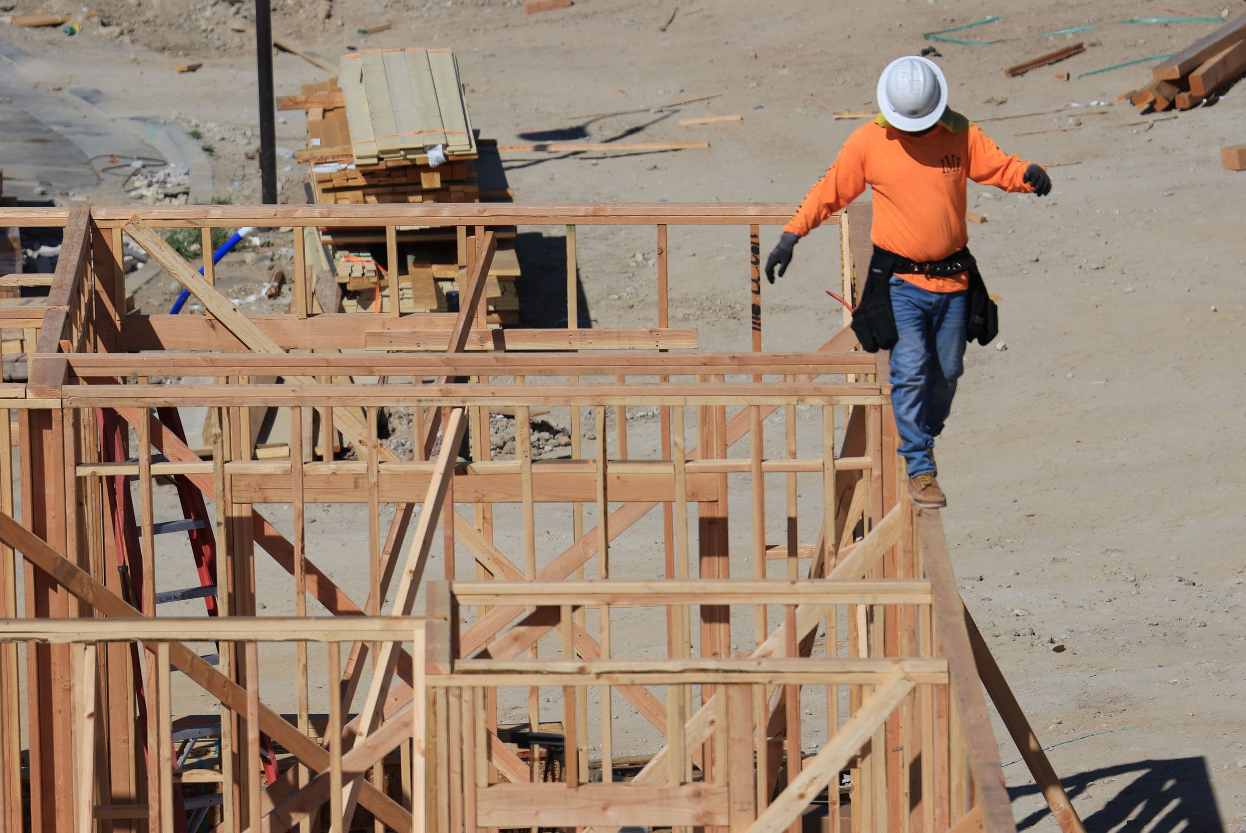 Construction crew celebrating a topping-off milestone at a high-rise site